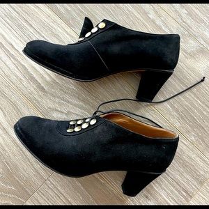 Super cute black suede shoe/boots with retro gold lace up buttons.